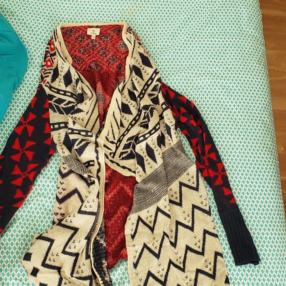 A sweater/ shawl